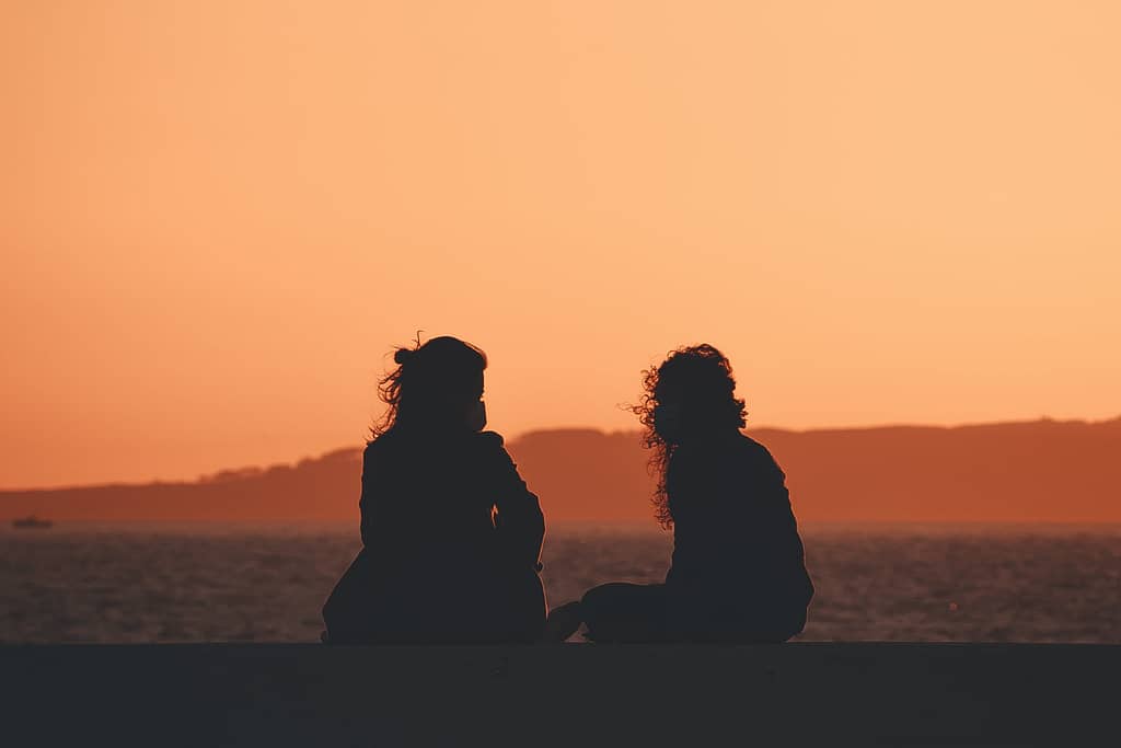 friends chatting to reduce the negative self-talk