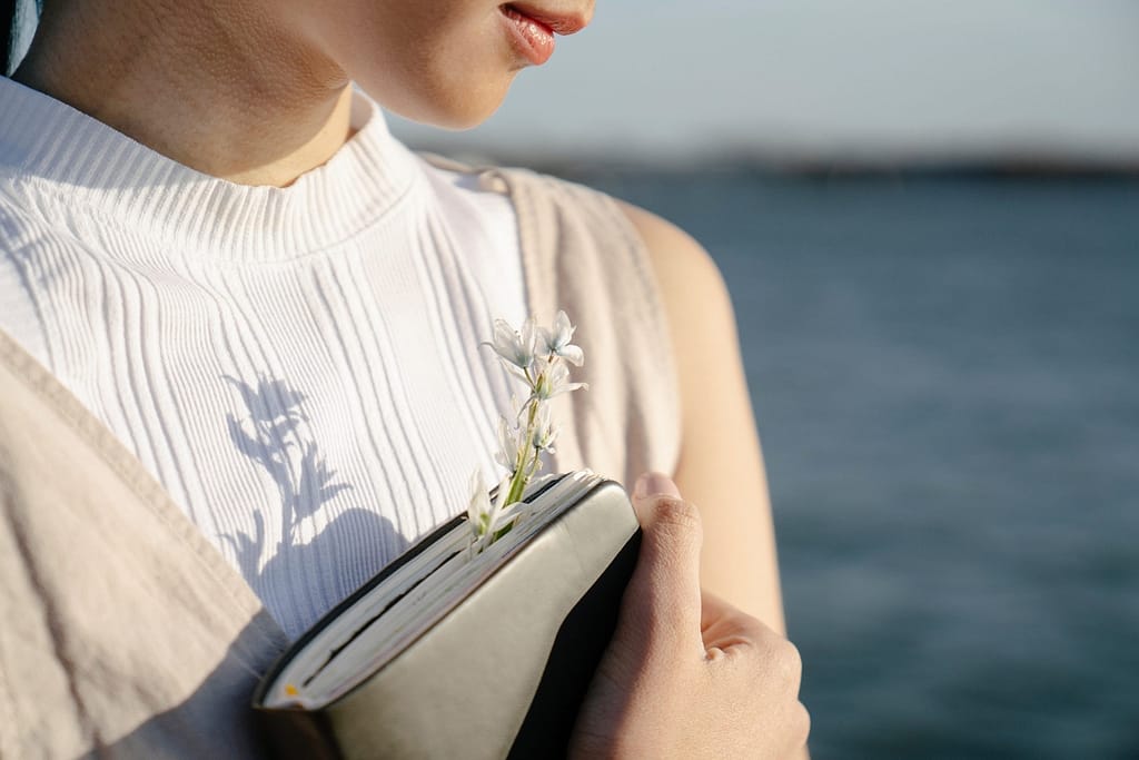 lady hugging journal